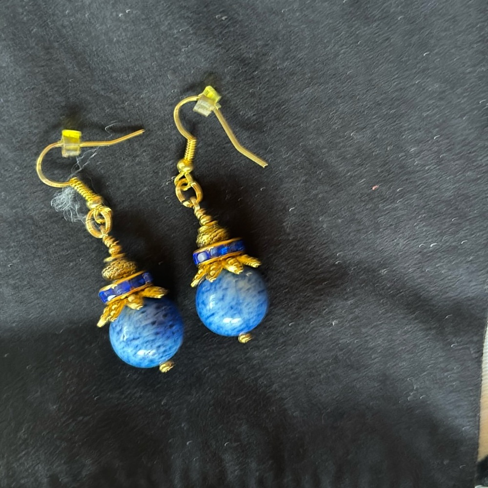 Earrings.Lapis blue with tiny blue stones between gold plated findings.